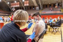 Sam Raabe receives his first dose of vaccine during a COVID-19 vaccination clinic April 20 at the Co
