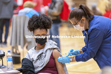 Meklit Aga receives her first dose of vaccine during a COVID-19 vaccination clinic April 20 at the C