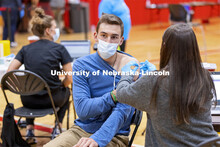 Dayton Mays receives his first dose of vaccine during a COVID-19 vaccination clinic April 20 at the 