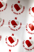 "I GOT MY COVID-19 VACCINE!" sticker. Vaccine clinic in the Coliseum with a free food and goodies te