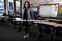 Sydney Trench, an elementary education major, poses in an elementary classroom for an ASEM recruitme