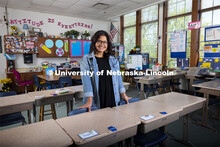Sydney Trench, an elementary education major, poses in an elementary classroom for an ASEM recruitme