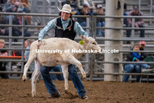 Nebraska’s Grant Lindsley competes in the tie down roping event at the Nebraska Cornhusker College