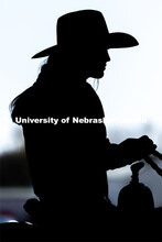 A rider sits and waits for the next event at the Nebraska Cornhusker College Rodeo at the Lancaster 