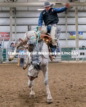 Nebraska’s Sam Florell competes in the saddle bronc riding event at the Nebraska Cornhusker Colleg