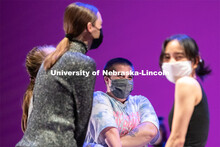 Senior University of Nebraska-Lincoln dance students smile as they are told to gather in the center 