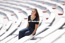 Erika Swenson, a Fisheries and Wildlife major, is pictured sitting in Memorial Stadium an ASEM recru
