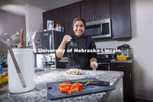 Nidhi Polekar, a triple major in Political Science, English, and Film Studies. She is pictured cooki
