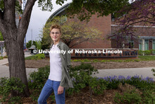 Lee Paulson, a senior political science major poses in front of the Van Brunt Visitor’s Center for