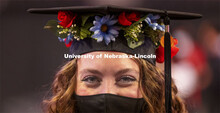Alexa Allen wore flowers around her mortar board while collecting her master’s degree in education