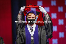 James Glover receives his hood during College of Law Graduation at Pinnacle Bank Arena. May 7, 2021.