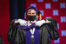 James Glover receives his hood during College of Law Graduation at Pinnacle Bank Arena. May 7, 2021.