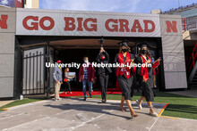 Graduates step on the field Saturday morning at the UNL Commencement in Memorial Stadium. May 8, 202