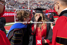 Julia Boogaard with Mike Boehm, Tiffany Heng-Moss and Ronnie Green. UNL Commencement in Memorial Sta