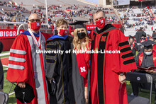 Julia Boogaard with Mike Boehm, Tiffany Heng-Moss and Ronnie Green. UNL Commencement in Memorial Sta
