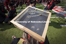 Courtney Wallner decorated her mortar board with live bees. UNL Commencement in Memorial Stadium. Ma