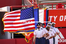 Flags stand at attention at the morning ceremony along with Cadet Sophie Byland and the ROTC Combine