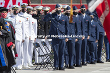 ROTC cadets salute the flag during the national anthem. UNL Commencement in Memorial Stadium. May 8,