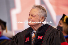 Former Husker Head Coach Tom Osborne watches an introductory video on the big screen.  Osborne deliv
