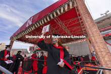 Jessica Nogelmeier gestures after receiving her architecture degree. UNL Commencement in Memorial St