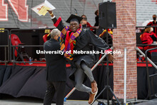 DeShawn McGary lets his graduation joy show as he walks off the ramp. McGary, who received a CoB deg