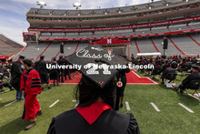 Delaney Zimmerman walks towards the stage and her College of Business diploma. UNL Commencement in M