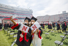 Ana Rodriguez and Brooke Lamkins take a selfie after the morning commencement. UNL Commencement in M