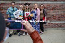 Brittany Stewart poses with family for a photo following the morning commencement. UNL Commencement 