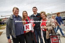 Erika Swenson and family pose for a picture following commencement. UNL Commencement in Memorial Sta