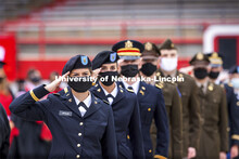 New Army Second Lieutenants including Alex Ketzler salute the color guard at the beginning of the se