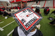Alexa Mustard’s mortar board is signed by her students in the classroom where she did her student 