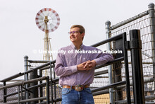 Bryar Gerlach, a senior animal science major, poses by a corral for an ASEM recruitment feature stor