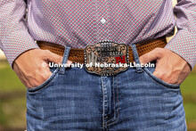 Bryar Gerlach, a senior animal science major, poses by a corral for an ASEM recruitment feature stor