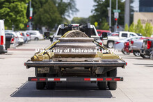 The capital, shaft and base of each column is hauled to storage. The columns outside of Memorial Sta