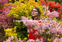 Daelyn Zagurski, a senior fisheries and wildlife major, poses amongst the azaleas on East Campus for