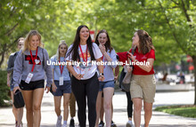 NSE Orientation Leader Gracie Williams talks with her group as they walk through campus. New Student