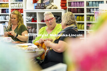 Rene Botts, center, talks with Stacy Stupka as Maggie Rawlings knits in the background. The three we