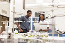 McNair scholar Seth Caines and summer research scholar Moriah Brown from Howard University work with