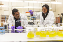 McNair scholar Seth Caines and summer research scholar Moriah Brown from Howard University work with