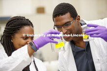 McNair scholar Seth Caines and summer research scholar Moriah Brown from Howard University work with