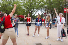Luiza Benvenuti (left) fires up her student group prior to introductions during a New Student Enroll