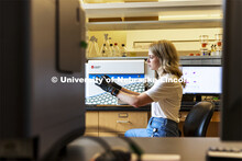 Graduate student Kari Heck places samples into a flow Cytometry analyzer in the Morrison Center for 