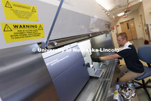 Flow Cytometry Service Center Manager, Dirk Anderson works with samples in a flow Cytometry sorter i