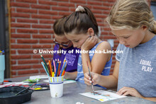 Elementary school campers at Adventure Art Camp paint at Cedar Point Station near Lake Ogallala. Ced