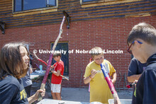 Young campers at Adventure Art Camp paint walking sticks at Cedar Point Station near Lake Ogallala. 