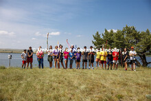 Campers at Adventure Art Camp pose for a picture with their newly painted walking sticks at Cedar Po