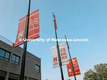 N banners on the flagpoles outside of the Nebraska Union on City Campus. July 21, 2021. 