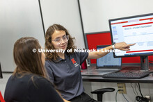 Dorian Bobbett and Professor Grace Panther discuss Bobbett’s McNair Scholar research project. July