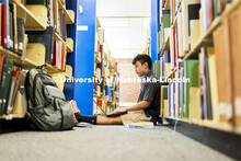 Daniel Nguyen, McNair scholar and senior in psychology, studies in Love Library. July 28, 2021. 