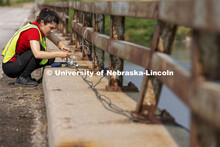 Mitra Nasimi connects a replacement cable for the bridge sensors before testing began on the Platte 